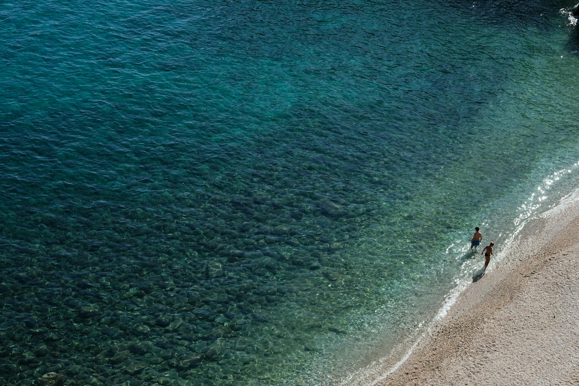 A sunny day at Thasos, Greece, with clear turquoise waters and relaxing beach strolls.